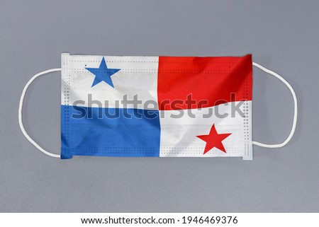 Isolated medical mask with flag of Panama on gray background. Closeup protective masks textile filter. Health care and medical concept. Coronavirus, virus in Panama