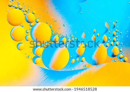Beautiful color abstract background from mixied water and oil. Pastel colored abstraction. Blue and yellow background
