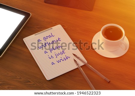 Work from home. desk office with laptop, blank notepad, coffee cup and pen on wood table. Top view copy space.
