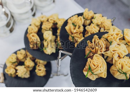 Catering service. Restaurant table with food at event. Shallow depth of view.