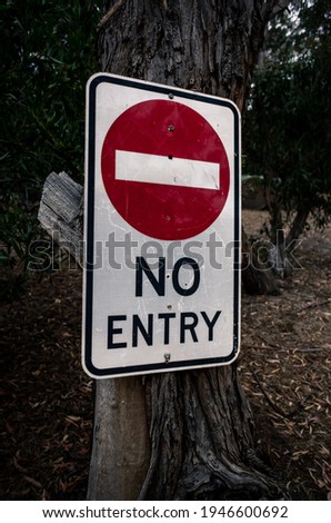 No entry sign on a tree