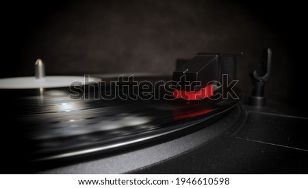 Record player in close-up - playing a vinyl - studio photography