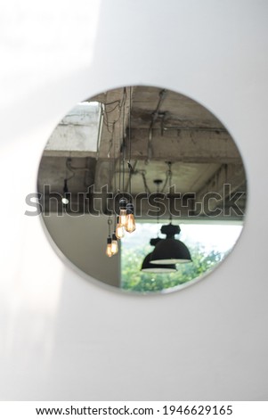 Circular mirror stuck on the wall