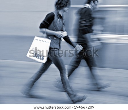 shopping in the city in motion blur and blue tonality