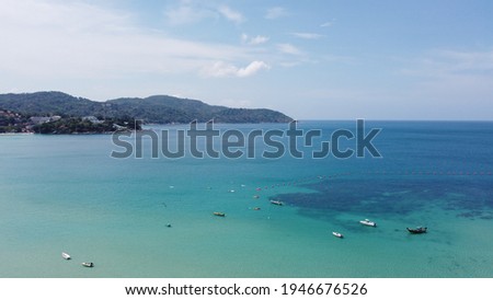 Aerial shot of drone Of a ship floating on the sea In the blue sky Bright weather on vacation