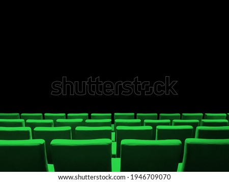 Cinema movie theatre with green seats rows and a black copy space background