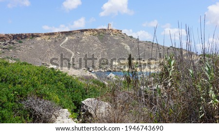 Panoramic view of Gnejna Bay with Ta' Lippija Tower on the mountain. Mgarr. Malta.