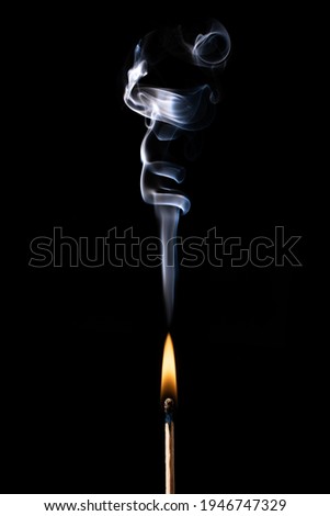 Wooden Matches on fire and smoke on black Royalty-Free Stock Photo #1946747329