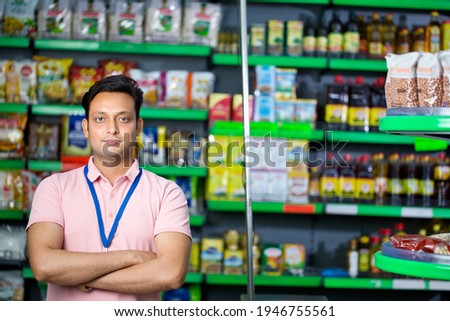 Salesman at grocery store products Royalty-Free Stock Photo #1946755561