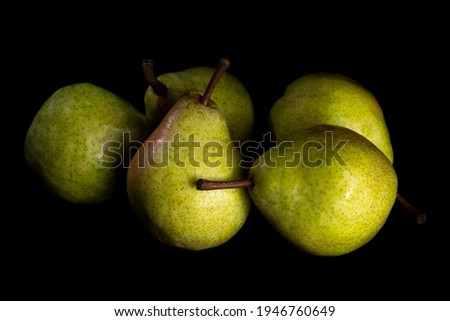 Pears in the dark. Still life low-key picture taken in studio using light painting technique.