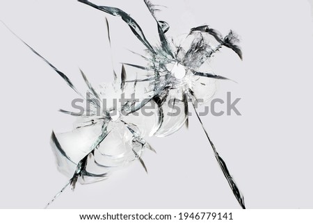 Shots on glass. holes with cracks, texture of cracks on broken glass.