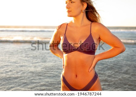 female model on the beach at sunset