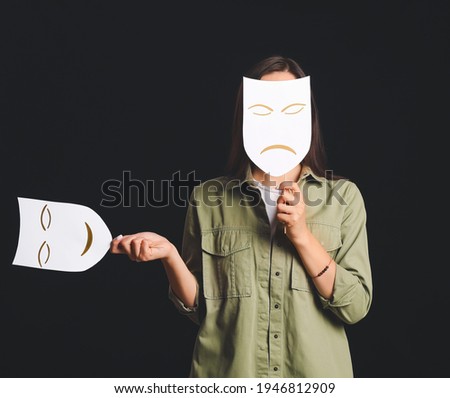 Young talented actress with different masks on dark background