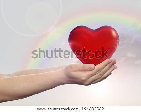 Concept or conceptual 3D red glass heart sign or symbol held in hands by a woman or child over nice rainbow sky background, metaphor to love, holiday, wedding, care, valentine, protection or romantic