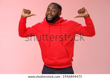 Proud confident arrogant good-looking african american bearded male coworker in red hoodie raise thumbs pointing himself bragging look cheeky talking accomplishments himself, standing pink wall Royalty-Free Stock Photo #1946844475