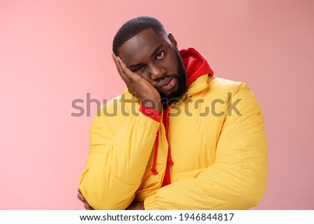 Annoyed bothered pissed african-american bearded man in yellow jacket facepalm look angry camera irritated lean head hand bored fed up pissed hearing uninteresting same stories, pink background Royalty-Free Stock Photo #1946844817