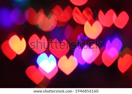 Colorful heart-shaped bokeh background for design
