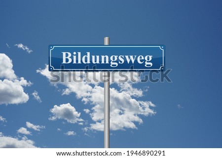 German word educational path on road sign in front of sky education school