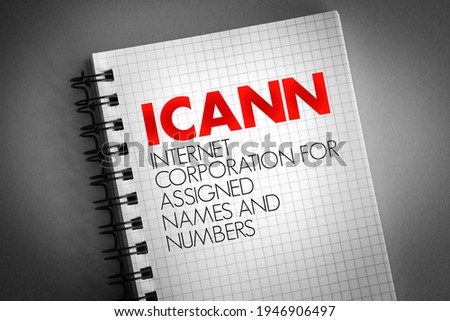 ICANN - Internet Corporation for Assigned Names and Numbers acronym on notepad, technology concept background