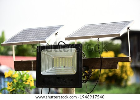 The small solar panel for Led lighting in the Village and Solar cell energy for electricity generation at home Royalty-Free Stock Photo #1946917540