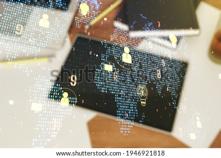 Double exposure of social network icons concept with world map and modern digital tablet on background. Networking concept