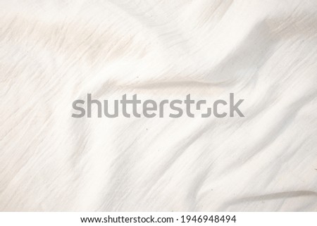 Fabric backdrop White linen canvas crumpled natural cotton fabric Natural handmade linen top view background Organic Eco textiles White Fabric linen texture 