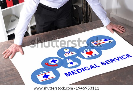 Man watching a medical service concept placed on a desk
