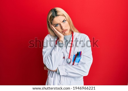 Young caucasian woman wearing doctor uniform and stethoscope thinking looking tired and bored with depression problems with crossed arms. 