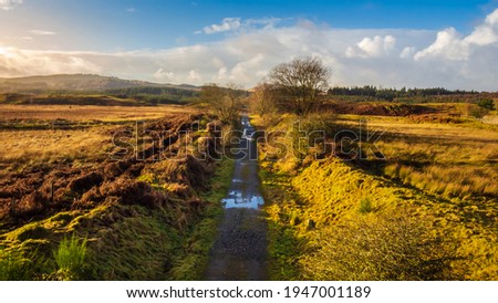 The remains of the old Galloway Railway line or paddy line and landscape at Mossdale, heading into the Galloway Forest Park, near New Galloway, Dumfries and Galloway, Scotland Royalty-Free Stock Photo #1947001189