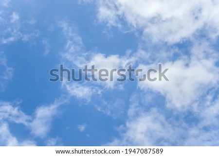 White clouds against blue sky as background.