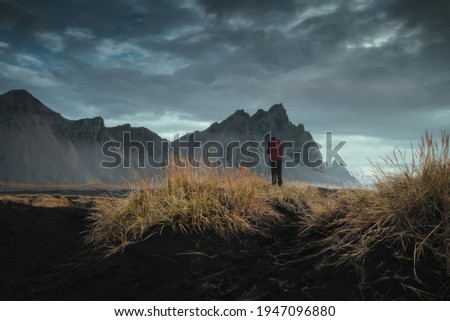 Professional landscape photographer with camera on tripod are taking nature picture. Vestrahorn mountain at Stokksnes in Iceland