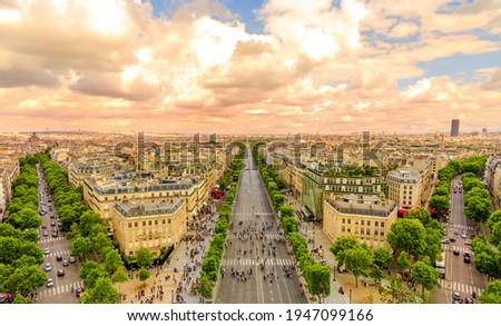 Aerial view of Paris skyline from Arc de Triomphe at sunset light. Triumphal Arch in Place Charles de Gaulle with Avenues Champs Elysees street in front. Scenic urban cityscape Royalty-Free Stock Photo #1947099166