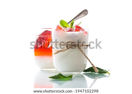 homemade sweet yogurt with fruit jelly pieces in a glass