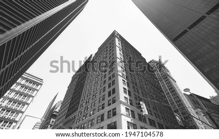 Looking up at Manhattan buildings, black and white picture, New York City, USA.