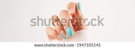 Womans hand with trendy turquoise manicure with copy space Royalty-Free Stock Photo #1947105145