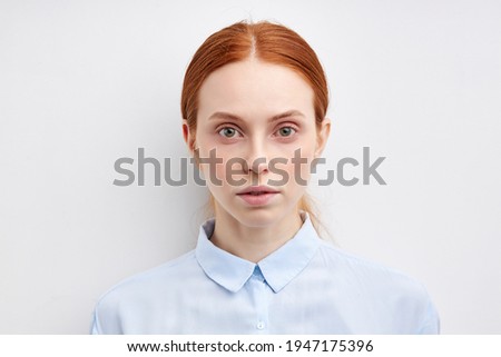 Confident beautiful young business woman standing isolated on white background. close up face headshot portrait