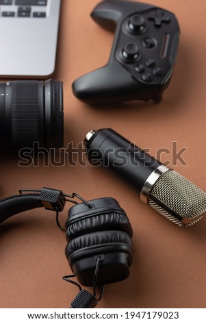 Background for blogger or streamer. Camera, laptop, headphones and joystick.