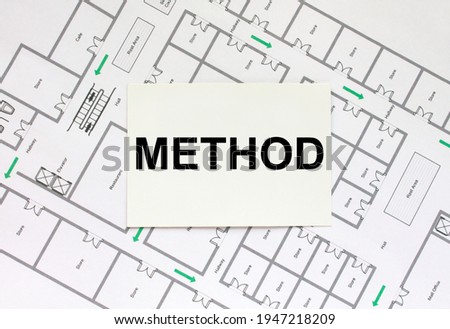 Business card with text Method on a construction drawing. Concept photo