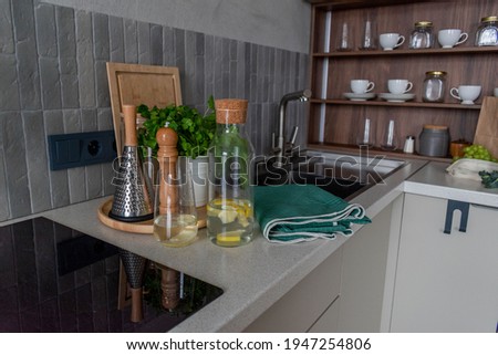 Organization kitchen space at home. Water with lemon in decanter. Zero waste concept. Conscious consumption. Healthy eating