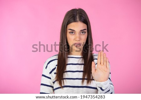 Close up photo amazing beautiful she her lady arm hand one palm raised up not allow go step next violence stop war make love calling wear casual sweater clothes isolated pink background Royalty-Free Stock Photo #1947354283