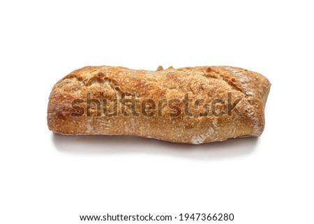 Small mini bakery baguette, with slits on top on a crisp golden crust, isolated on a white background