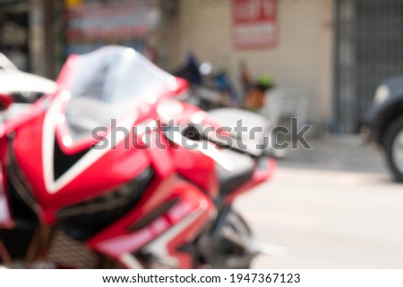 World environment day concept: Abstract blurred red motorcycle wallpaper background