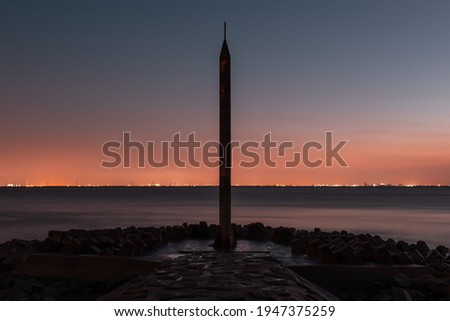Wonderful Summer Sunset Impression of lighthouse at the lake