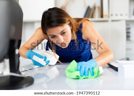 Portrait of young latina woman cleaner worker at work, office cleaning service Royalty-Free Stock Photo #1947390112