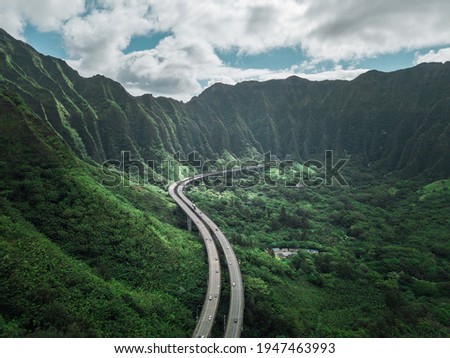 Aerial view of Oahu highway between the mountain of Hawaii. Road to Heaven. 