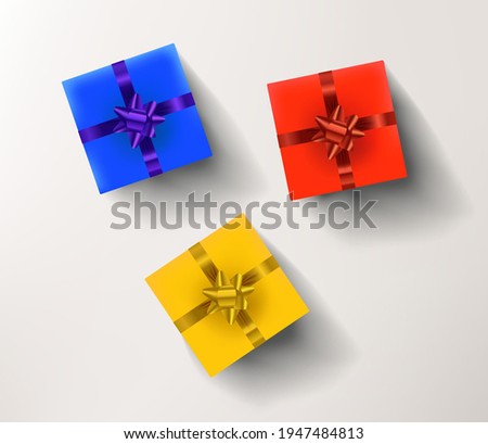 Yellow, red and blue gift boxes isolated on white background