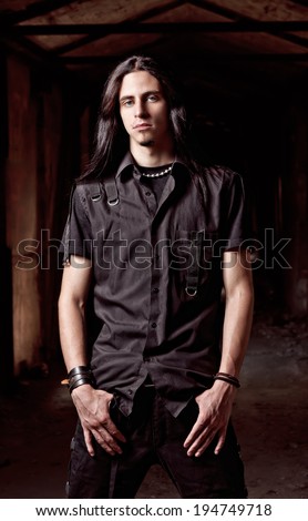 Portrait of a handsome young man with long hair