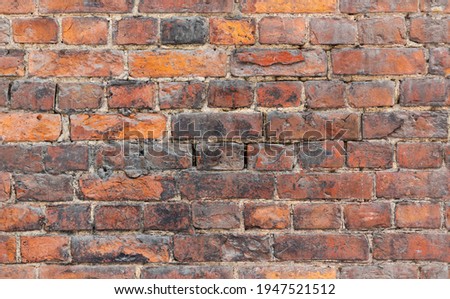 Seamless background photo of grungy red old brick wall, close-up photo texture