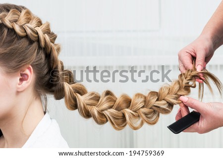 weave braid girl in a hair salon Royalty-Free Stock Photo #194759369