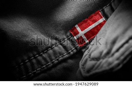 Tag on dark clothing in the form of the flag of the Denmark